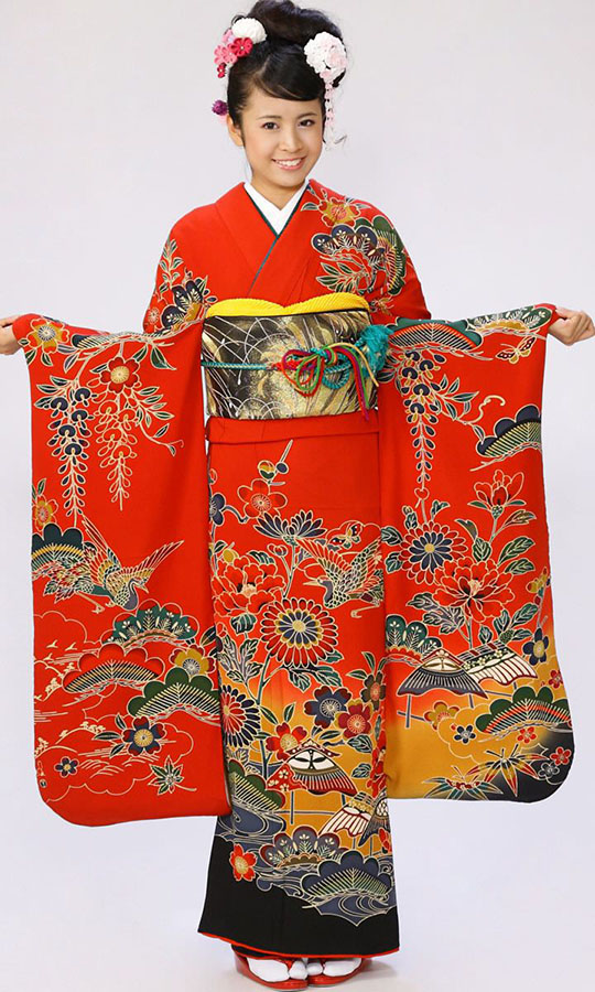 ung kvinna klädd i färgstark kimono som kallas furisode